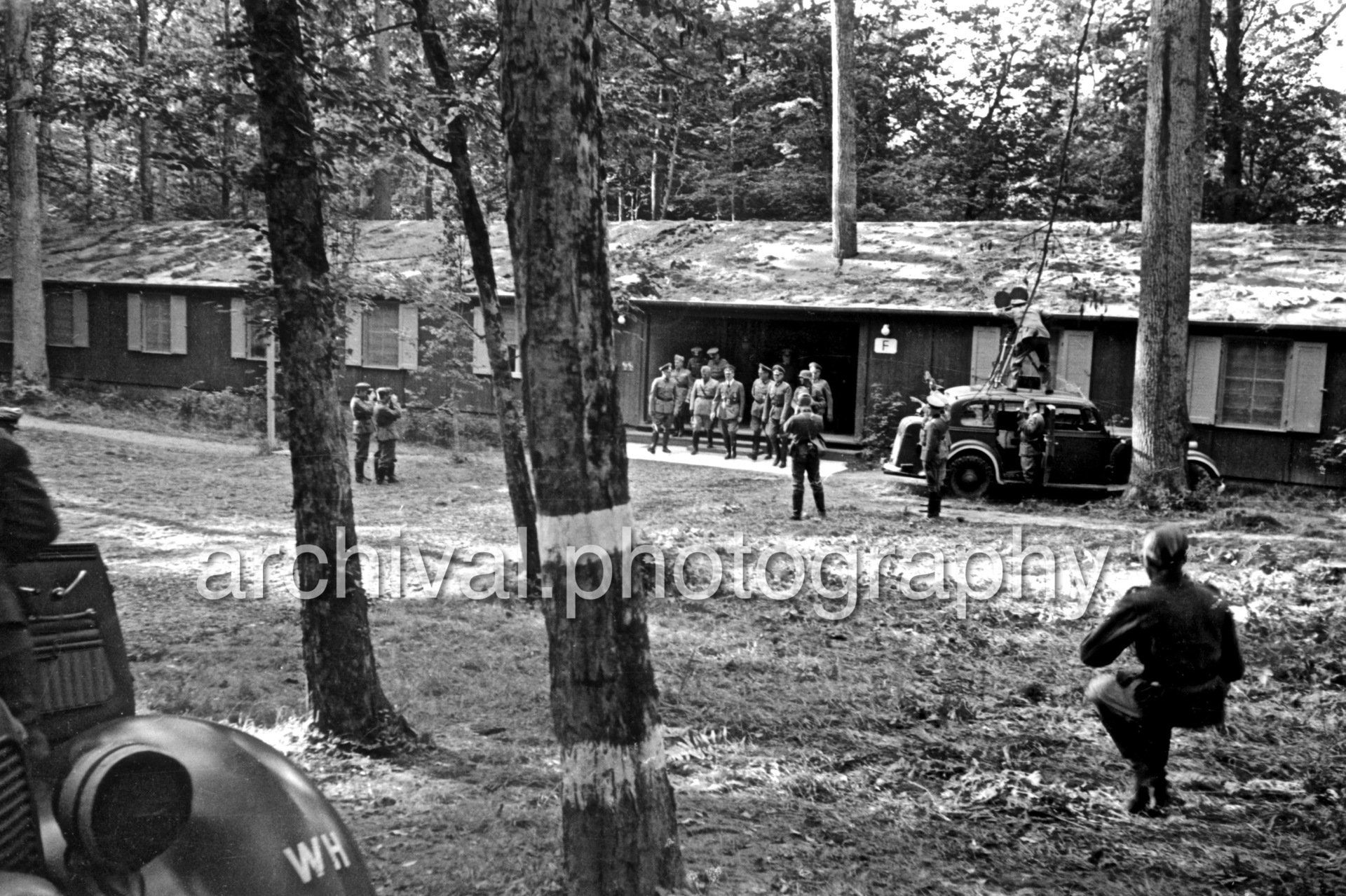 Group of SS meeting outside of cabin - Nazi Adolf Hitler and the Italian 'Il Duce' Benito Mussolini on the train platform at the 'Wolfsschanze' Wolf's Lair headquarters at Rastenburg in East Prussia