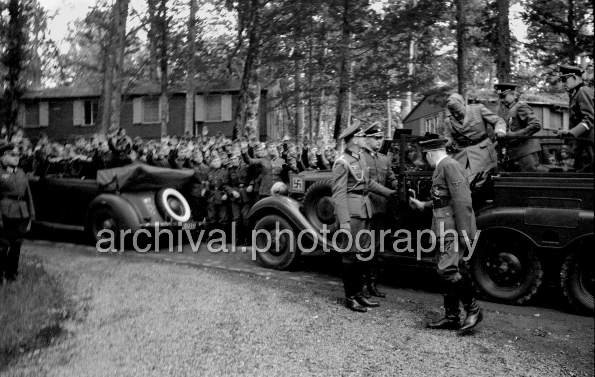 Multiple military vehicles parked in front of SS - Nazi Adolf Hitler and the Italian 'Il Duce' Benito Mussolini at the 'Wolfsschanze' Wolf's Lair headquarters at Rastenburg in East Prussia - Daimler Benz Aktiengesellschaft G4 touring wagon