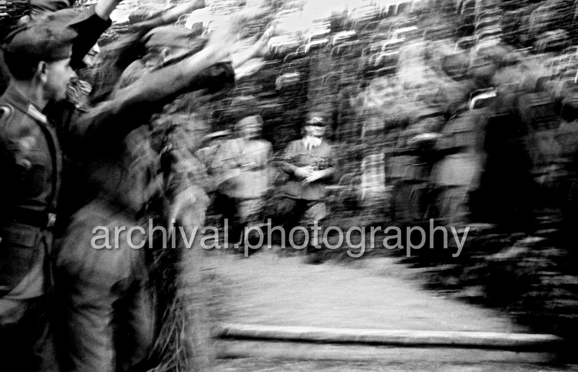 Blurry photo of soldier giving Nazi salute - Nazi Adolf Hitler and the Italian 'Il Duce' Benito Mussolini on the train platform at the 'Wolfsschanze' Wolf's Lair headquarters at Rastenburg in East Prussia