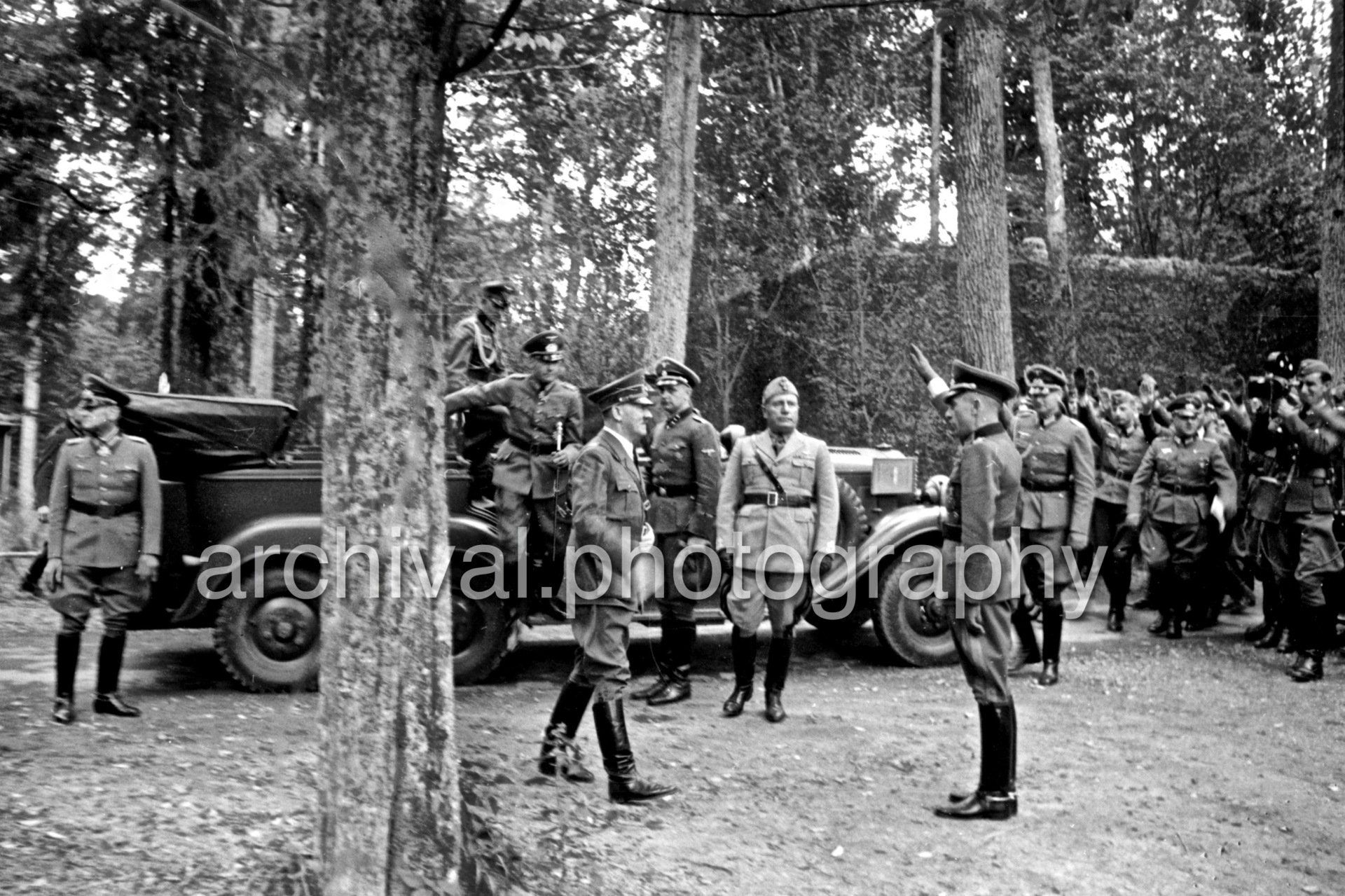 German Officers saluting Hitler and Mussolini - Nazi Adolf Hitler and the Italian 'Il Duce' Benito Mussolini at the 'Wolfsschanze' Wolf's Lair headquarters at Rastenburg in East Prussia - Daimler Benz Aktiengesellschaft G4 touring wagon