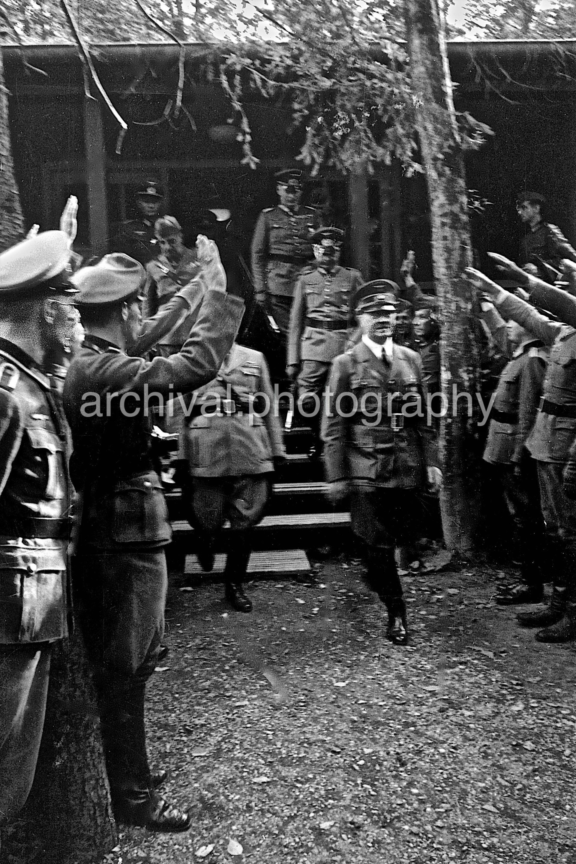 Hitler and Mussolini being saluted by German SS - Nazi Adolf Hitler and the Italian 'Il Duce' Benito Mussolini on the train platform at the 'Wolfsschanze'  Wolf's Lair  headquarters at Rastenburg in East Prussia