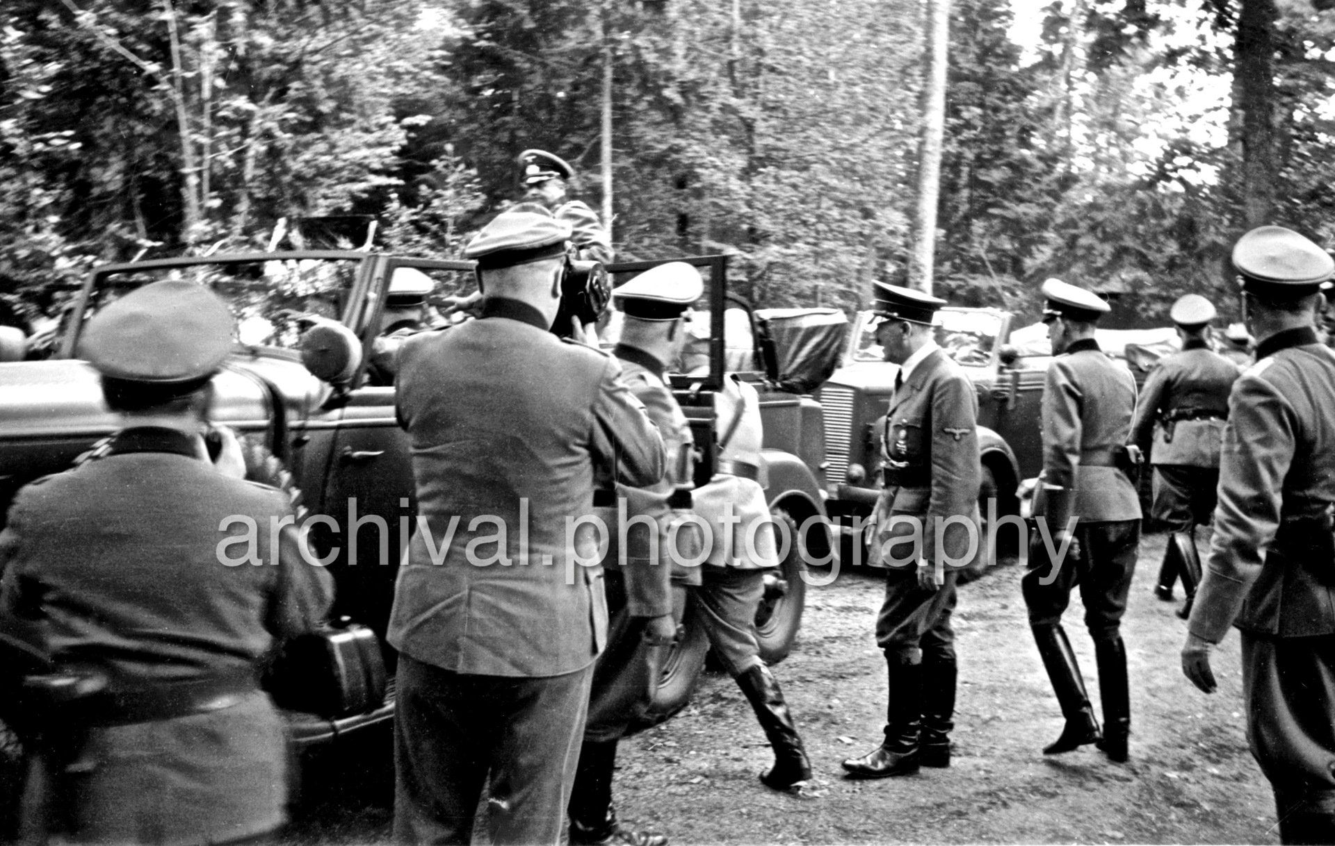 Hitler and Mussolini and entering Mercedes - Nazi Adolf Hitler and the Italian 'Il Duce' Benito Mussolini at the 'Wolfsschanze' Wolf's Lair headquarters at Rastenburg in East Prussia - Daimler Benz Aktiengesellschaft G4 touring wagon