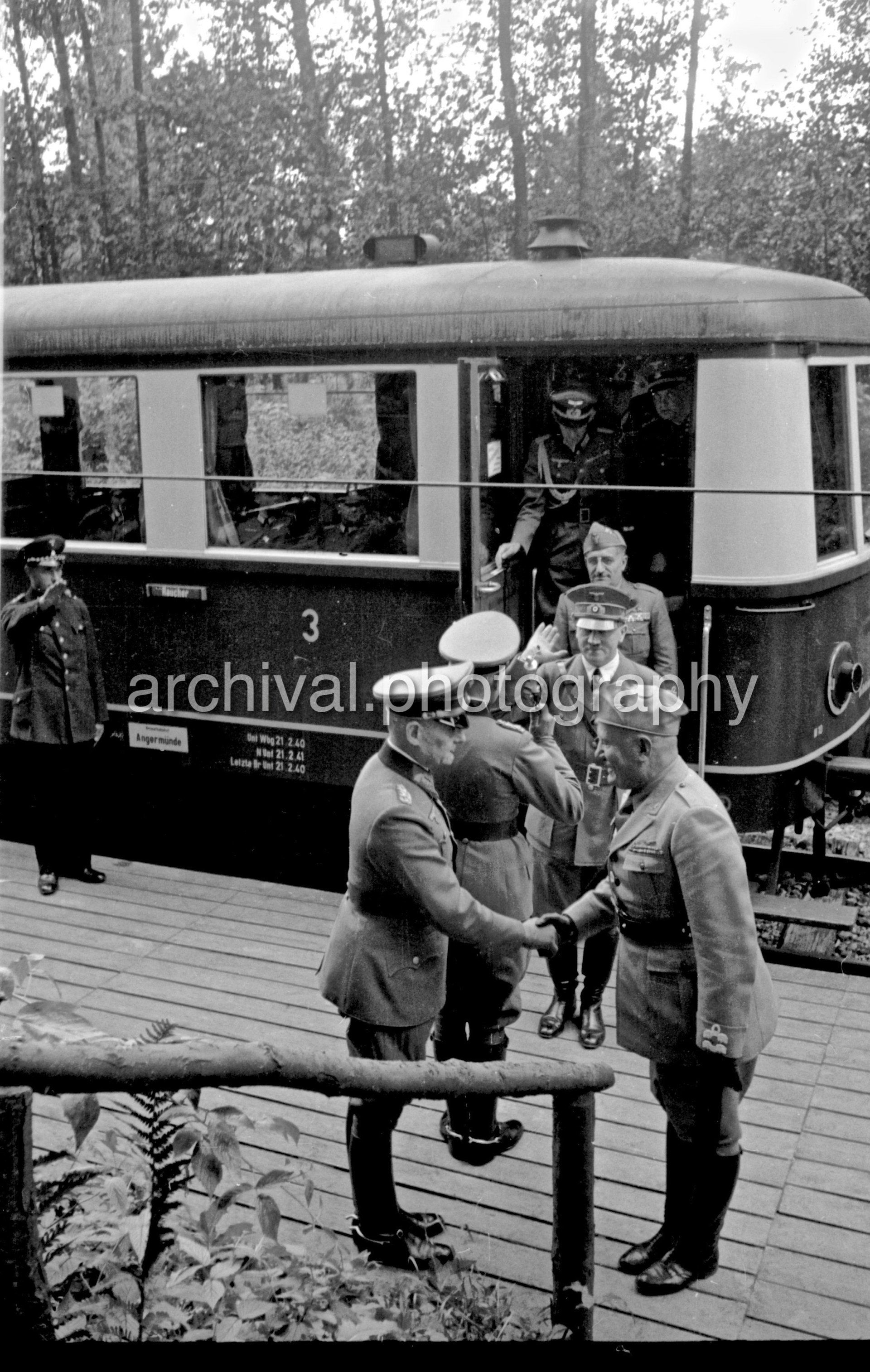 Hitler and German Officers stepping off Train - Nazi Adolf Hitler and the Italian 'Il Duce' Benito Mussolini on the train platform at the 'Wolfsschanze' Wolf's Lair headquarters at Rastenburg in East Prussia