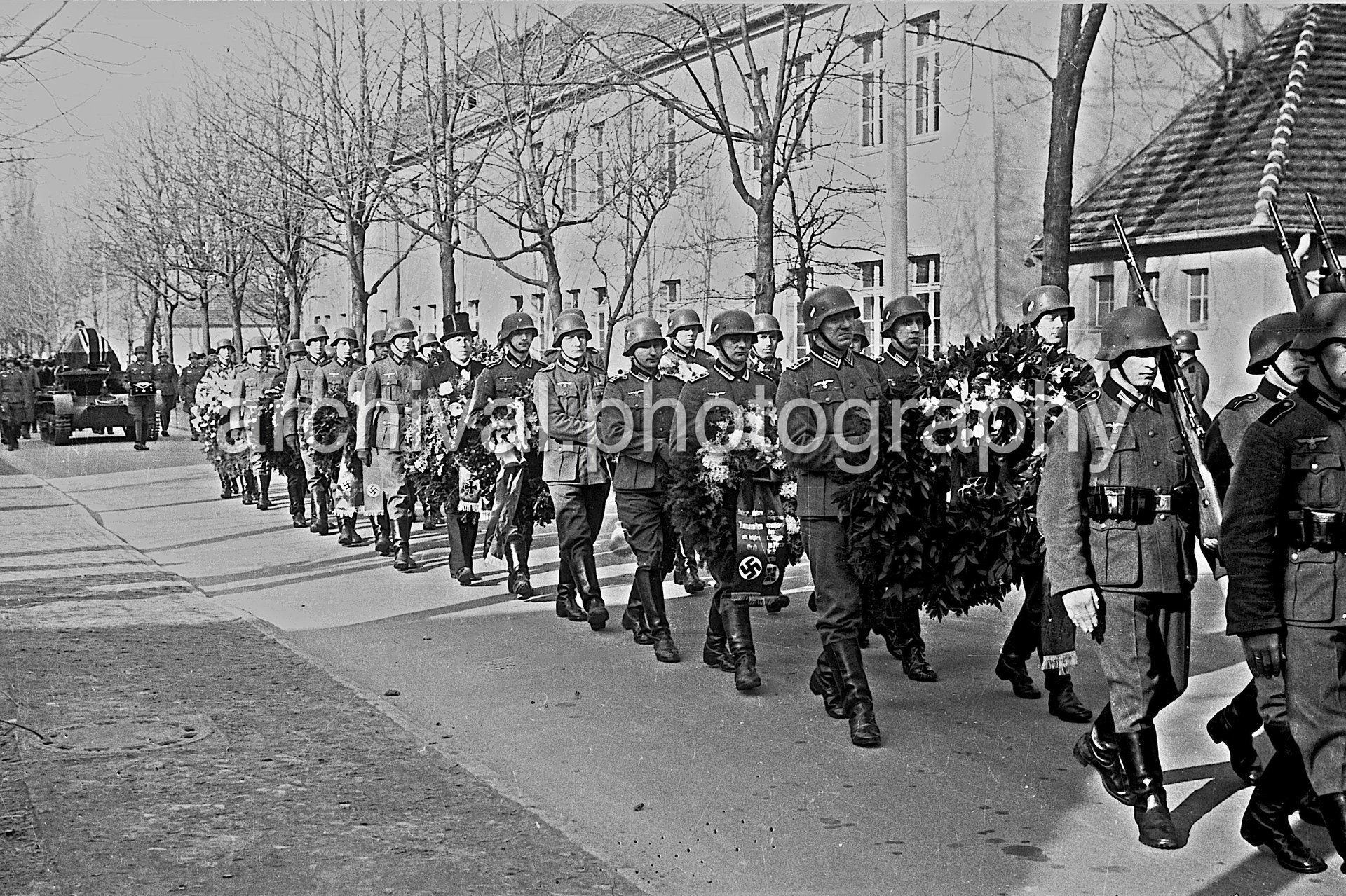 Honor Guard Soldiers marching with large flower bouquet - Nazi Funeral of Highly Decorated 1st Panzer Division Officer
