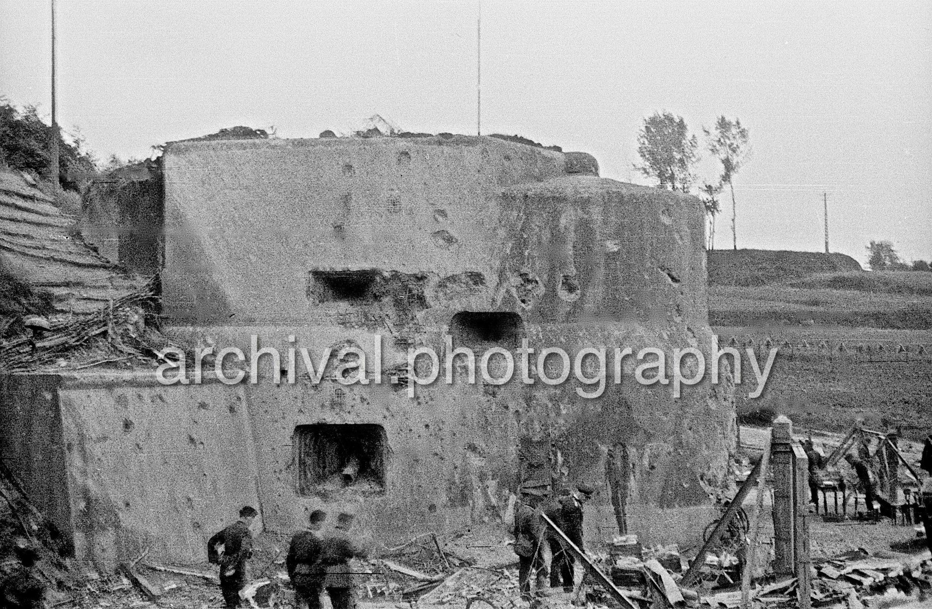 Damaged bunker with Nazi soldiers outside - Damaged Bunker - Belgian Fort Eben-Emael May 1940