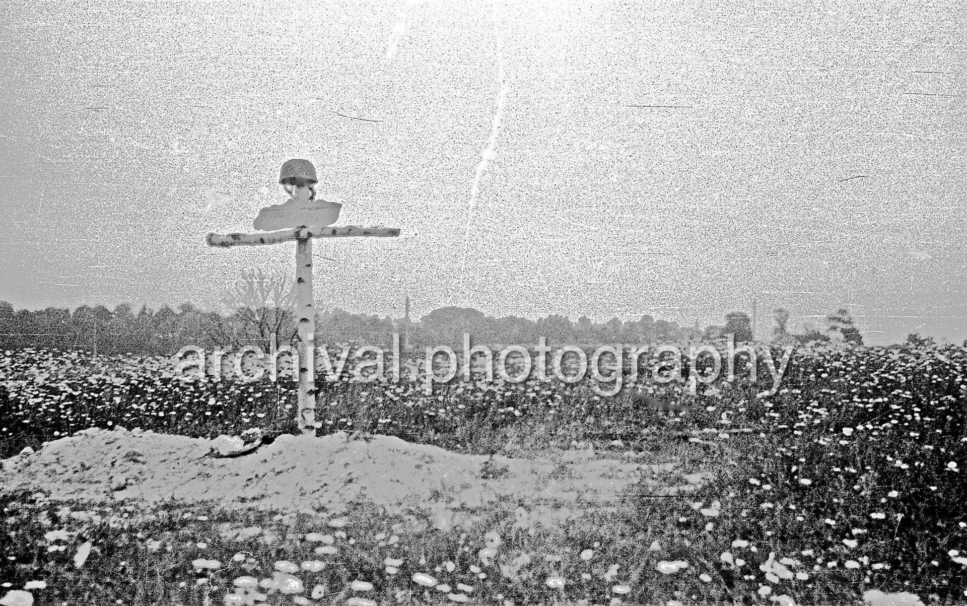 Wooden cross and field - Damaged Bunker - Belgian Fort Eben-Emael May 1940