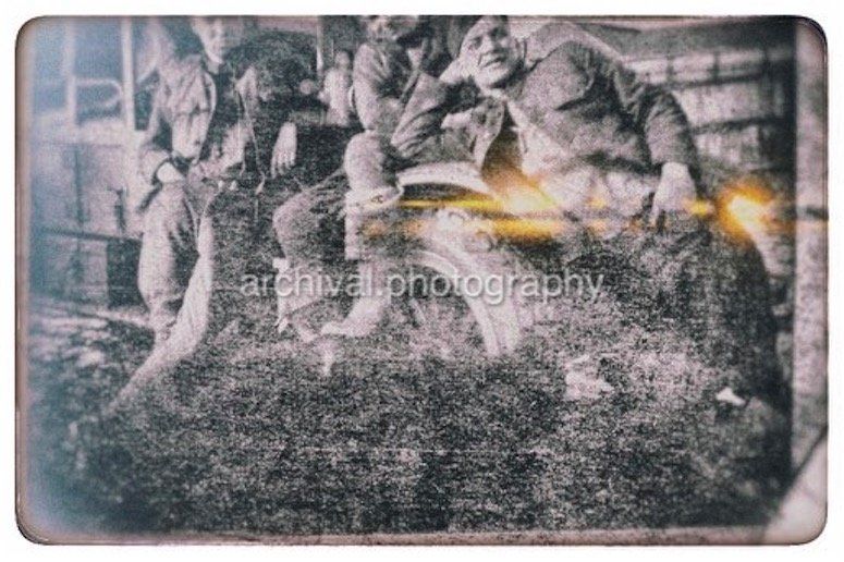 SODIERS POSING ON VEHICLE