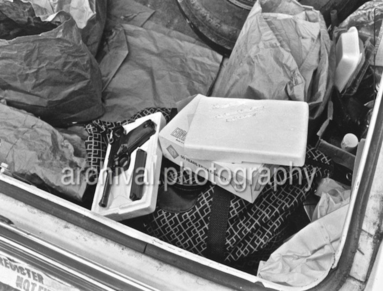 Gun and books in back of trunk