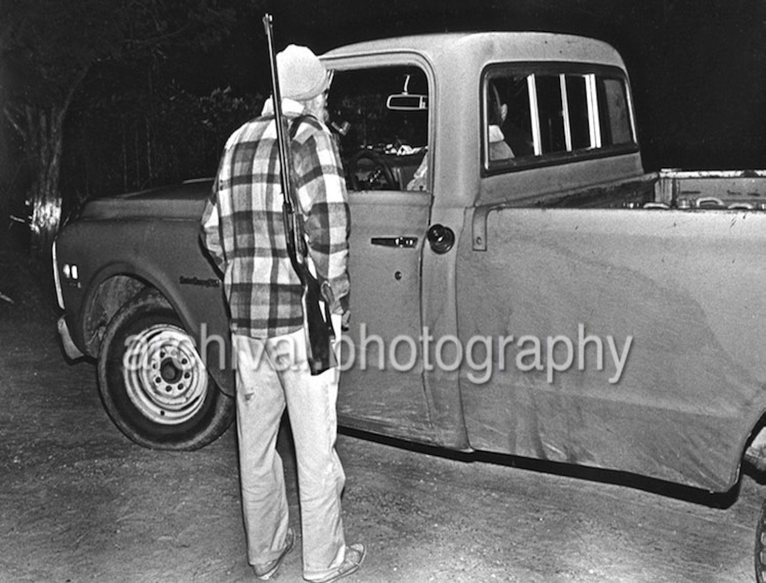 Ku Klux Klan - KLANSMAN SENTRY with rifle AT pickup truck