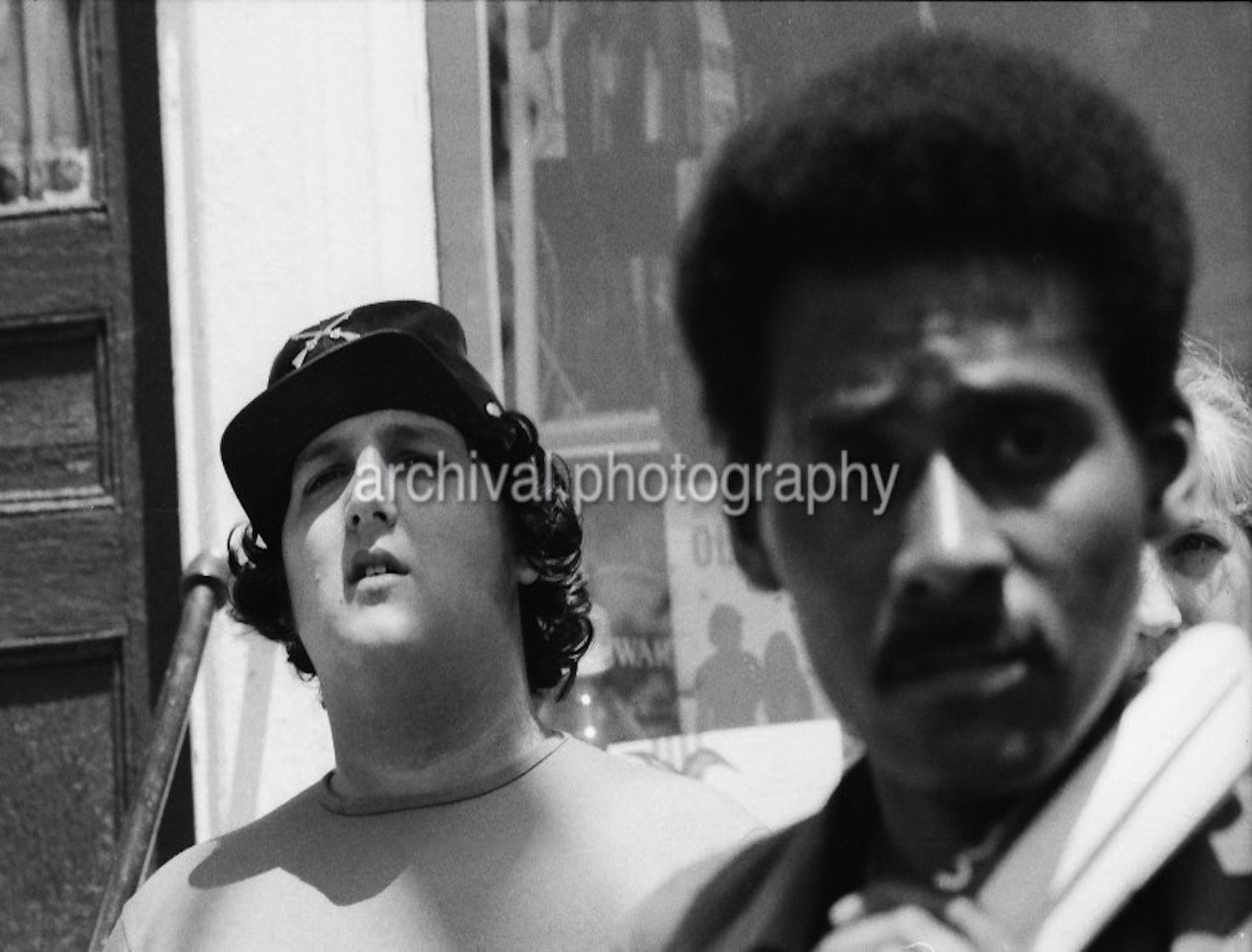 Two men staring into photo