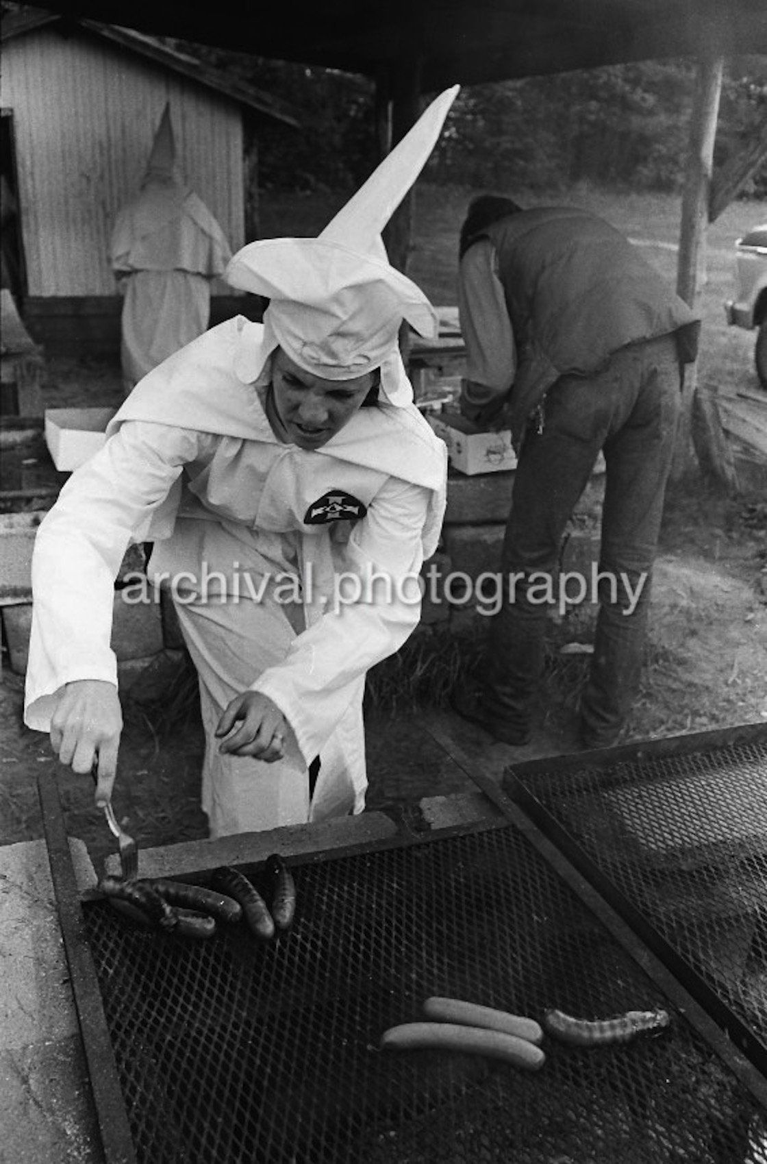 Ku Klux Klan - Female KKK member cooking food