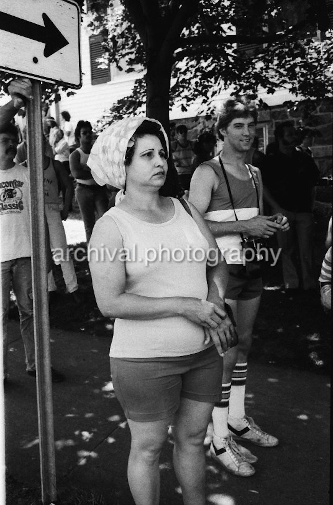 Woman standing on sidewalk