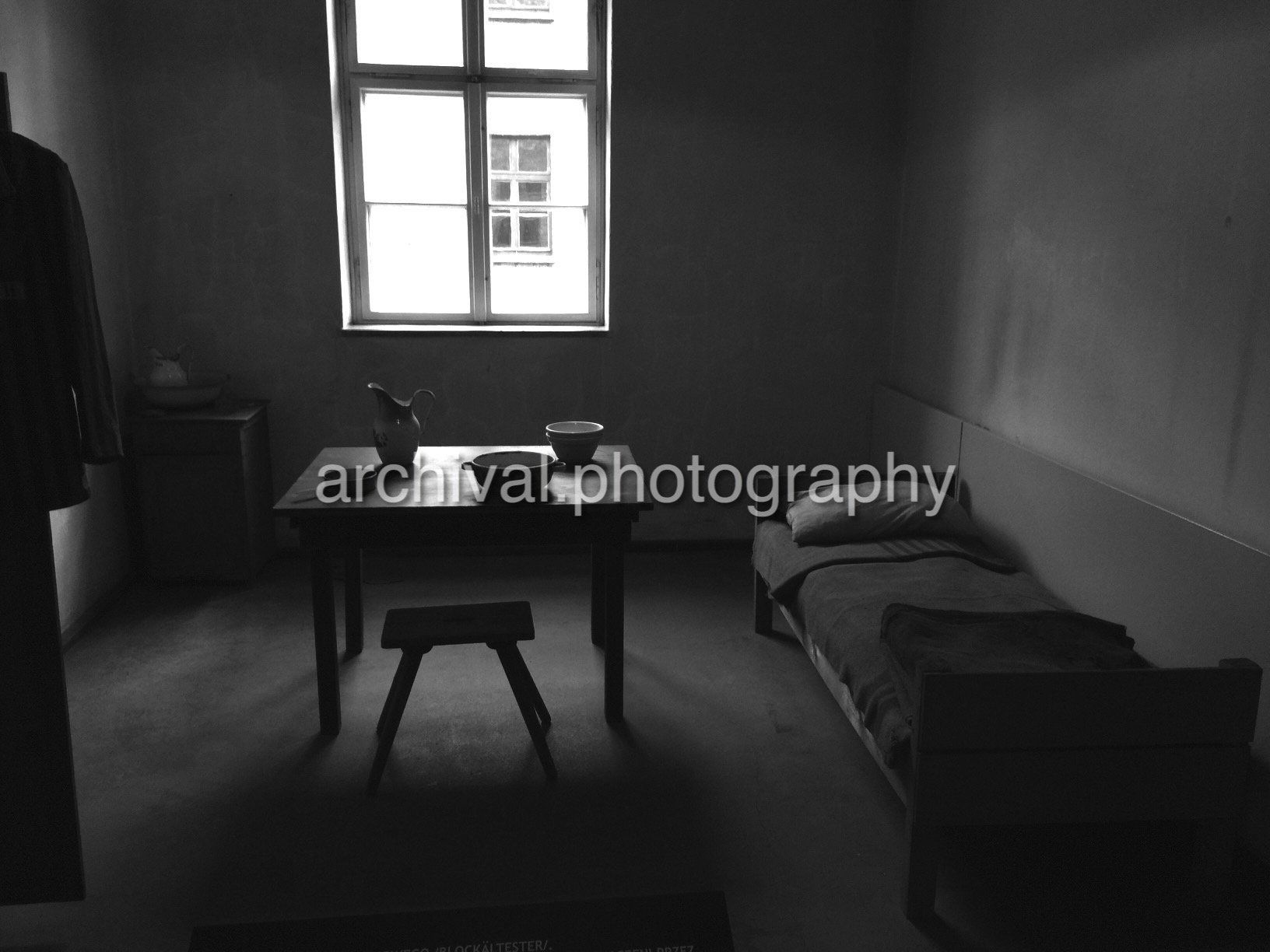 Small bedroom with table in the middle - Auschwitz Concentration Camp -