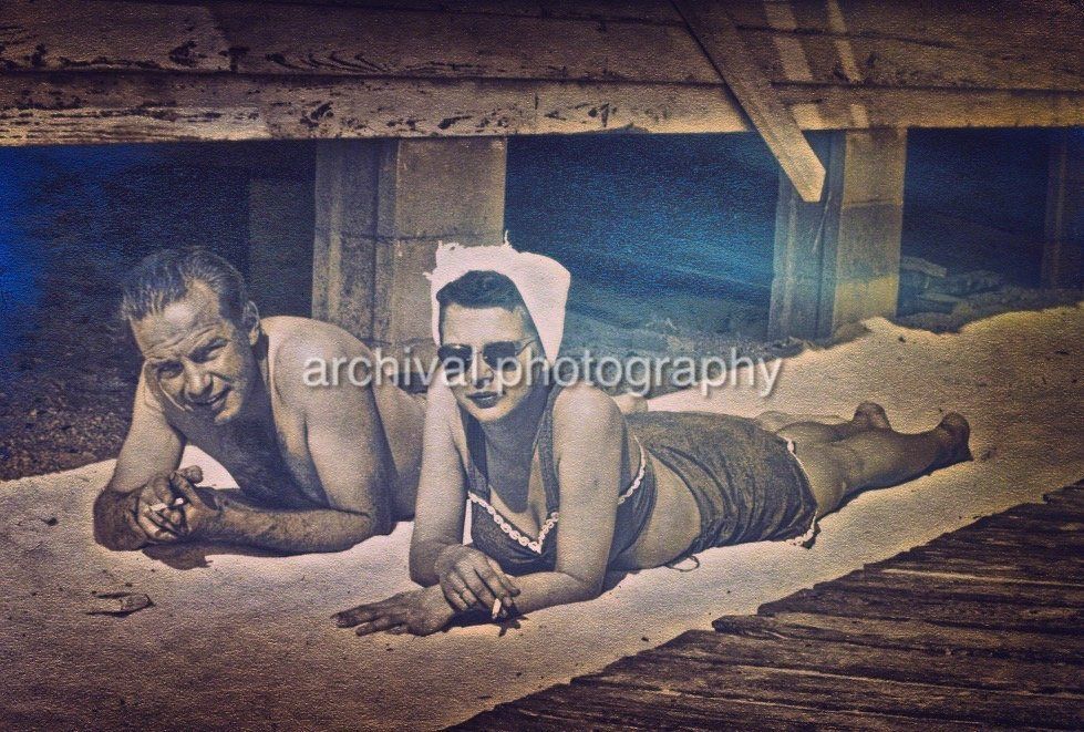 Man and woman tanning on towel - Candid WWII Photos Of GI's From All Sides