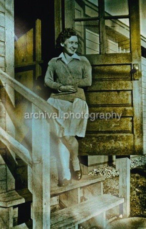 Woman standing outside of door - Candid WWII Photos Of GI's From All Sides
