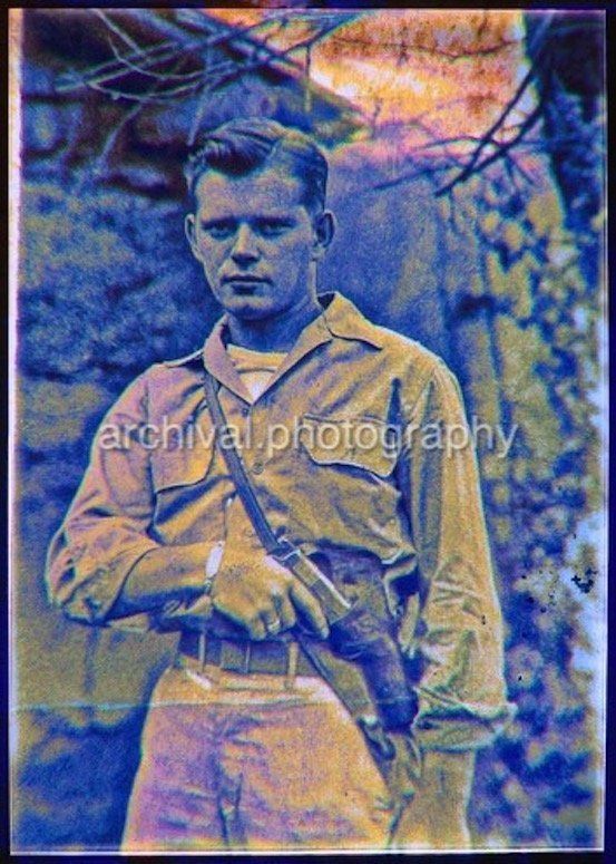 Portrait of US Army soldier with COLT 45 HANDgun IN SHOULDER HOLSTER