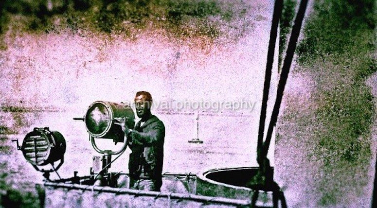 Candid WWII Photos Of GI's From All Sides - US SAILOR shining SPOT/SIGNAL light off side of ship