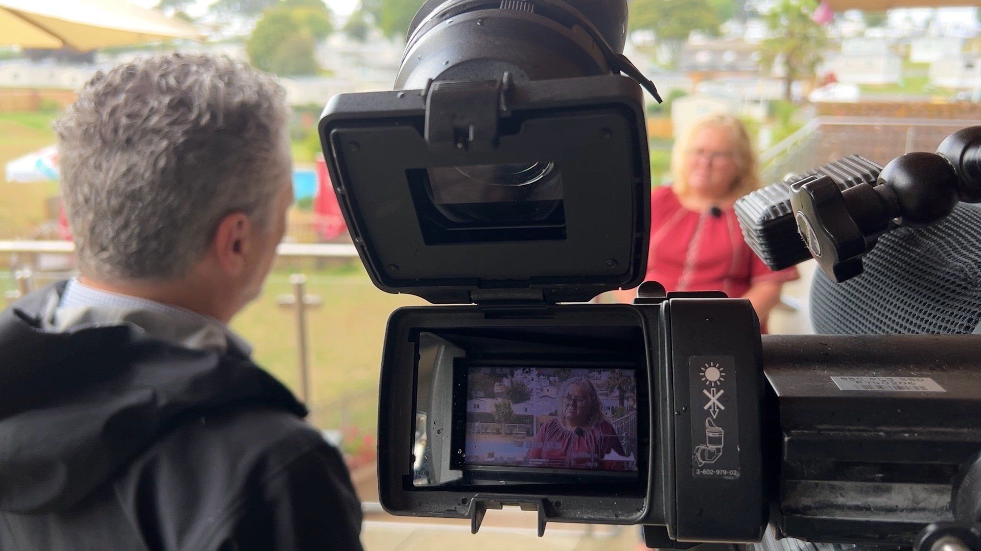 Broadcast camera filming interview