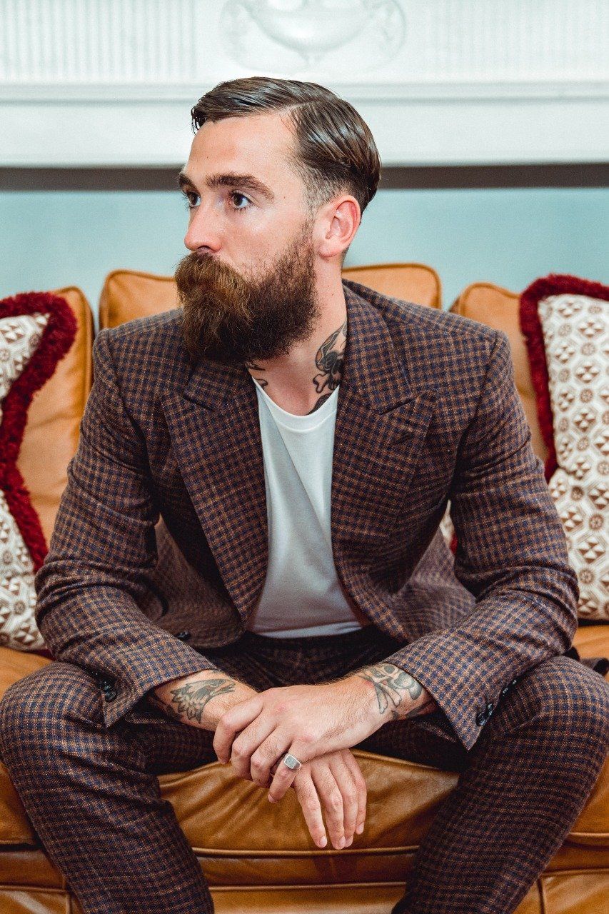 Adam Davies, founder and tailor at Adam James Bespoke, showcases a lightweight linen suit to keep cool during rising spring and summer temperatures