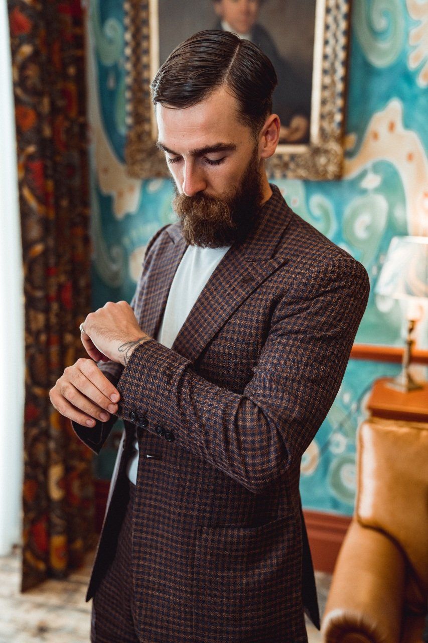 Adam Davies, of Adam James Bespoke, wears a linen and cotton suit from his Vegan seasonal range