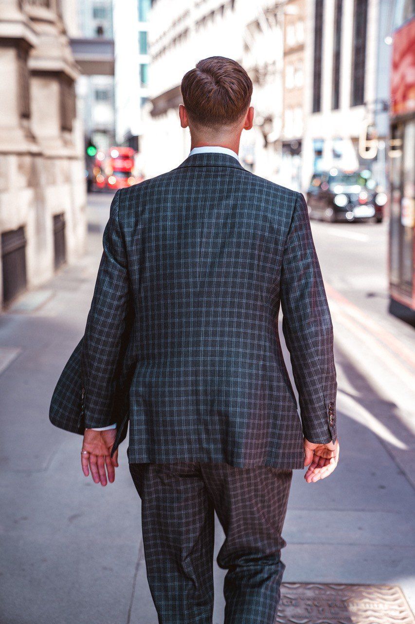 Adam Davies from Adam James bespoke wears a form-fitting lightweight seasonal suit to wick away heat during the summer months