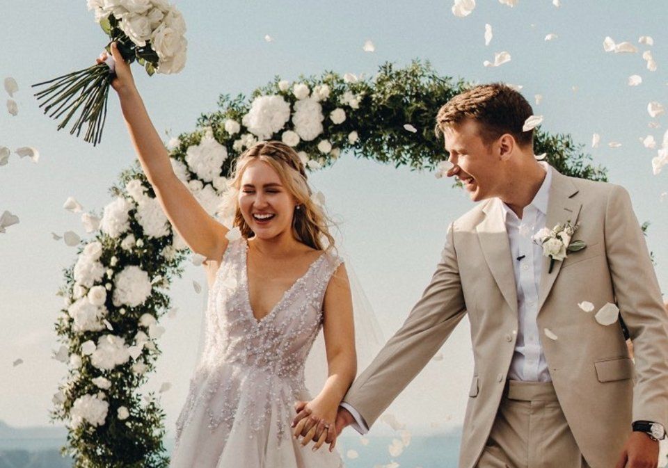 Adam Davies, founder and tailor of Adam James Bespoke, wears a crisp form-fitting dark blue suit