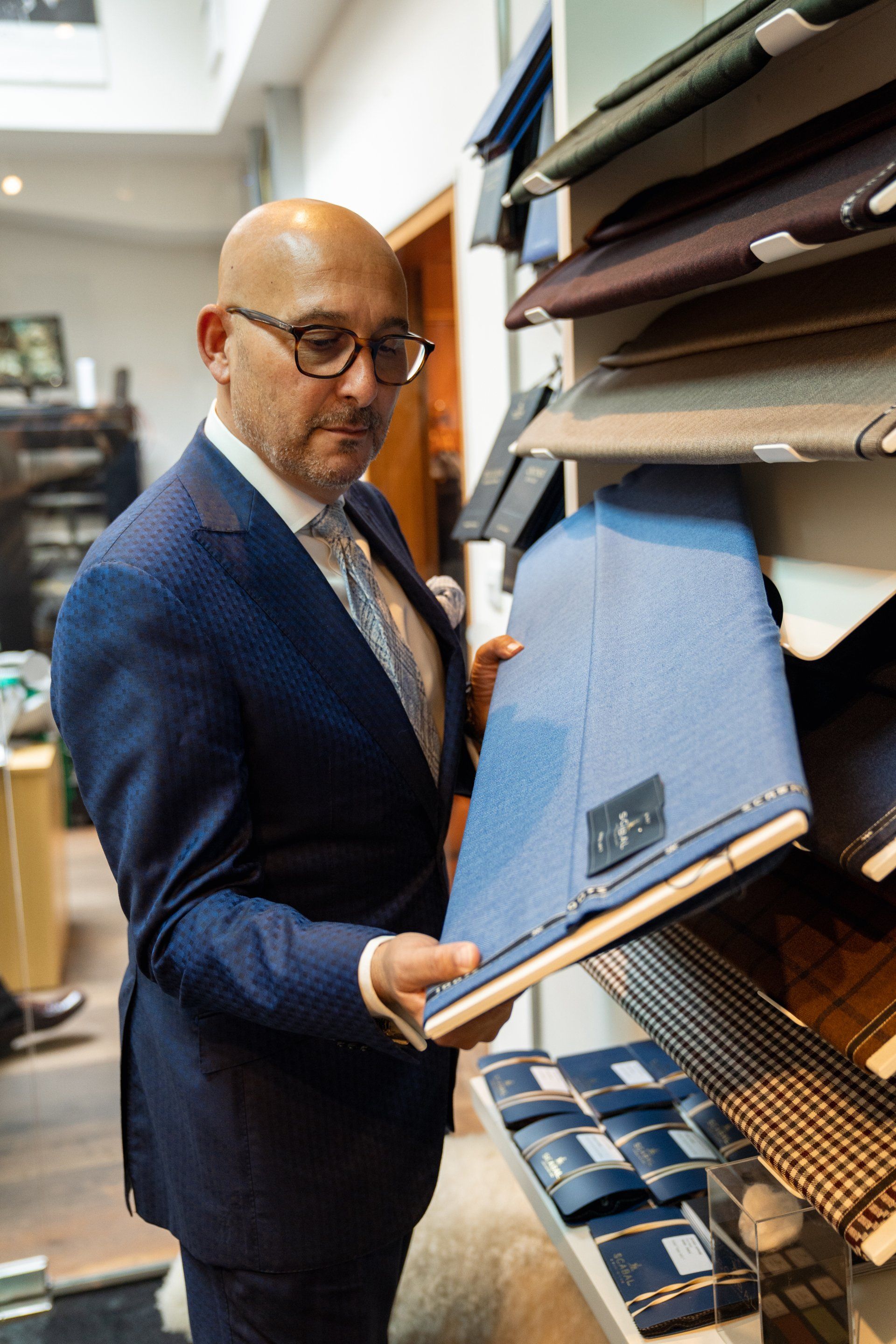 Andrew Goldberg of Savile Row's Scabal shows off his exclusive range of finely-milled fabrics