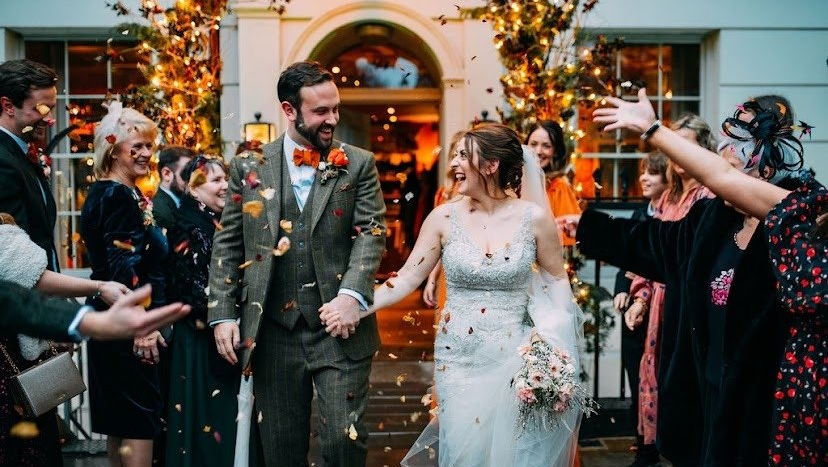Wedding suits from Adam James Bespoke tailoring, shown here by a client wearing a custom three-piece suit on his wedding day