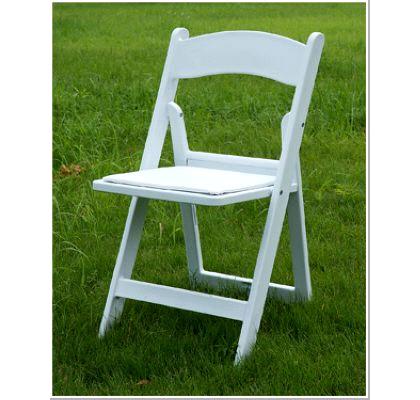 white garden resin folding chair on grass