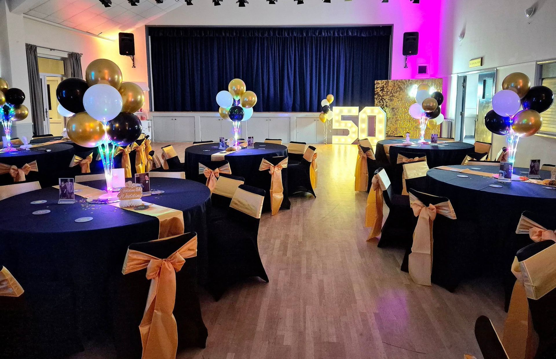 50th Birthday party setup in black and gold styling
