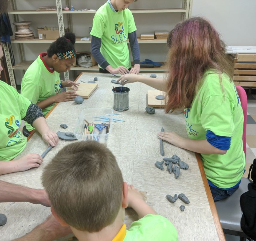 An image of Sleek Academy students creating pottery at The Big Fab Lab