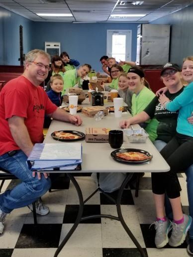 Image of Sleek Academy students at the pizza shop.
