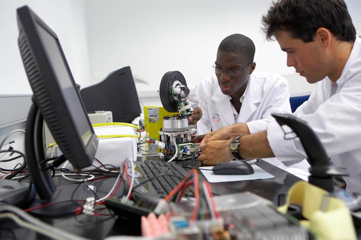 ARB SYSTEMS Research Development and Innovation, the image shows two people working in electronics.