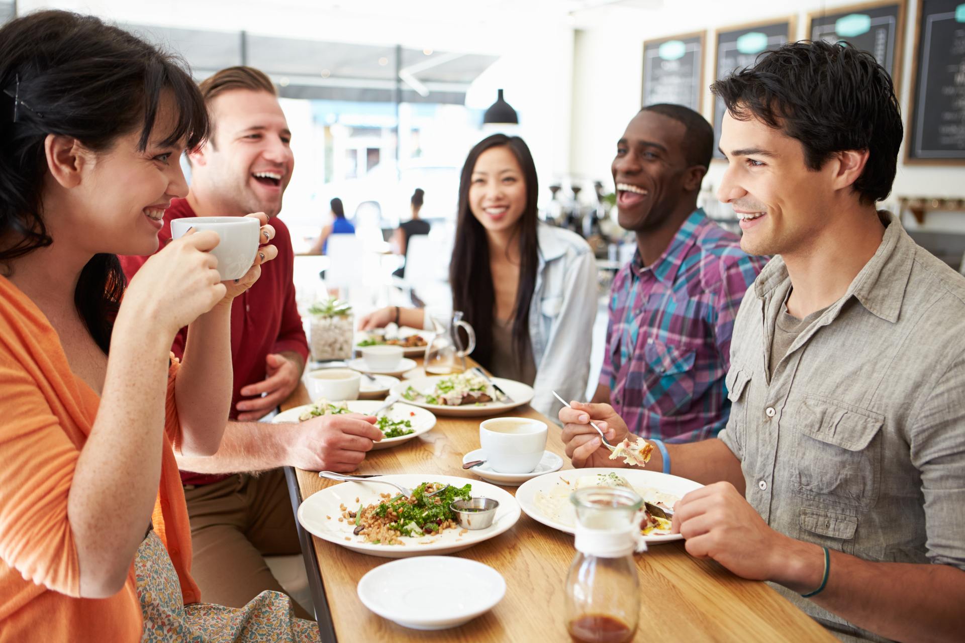 a group of people having food together
