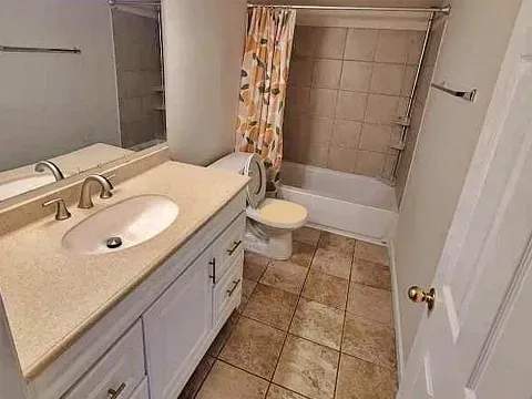 Full bathroom with bathtub and double vanity