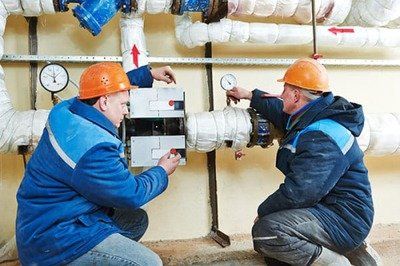 Ottawa Asbestos Removal Services workers on asbestos pipes