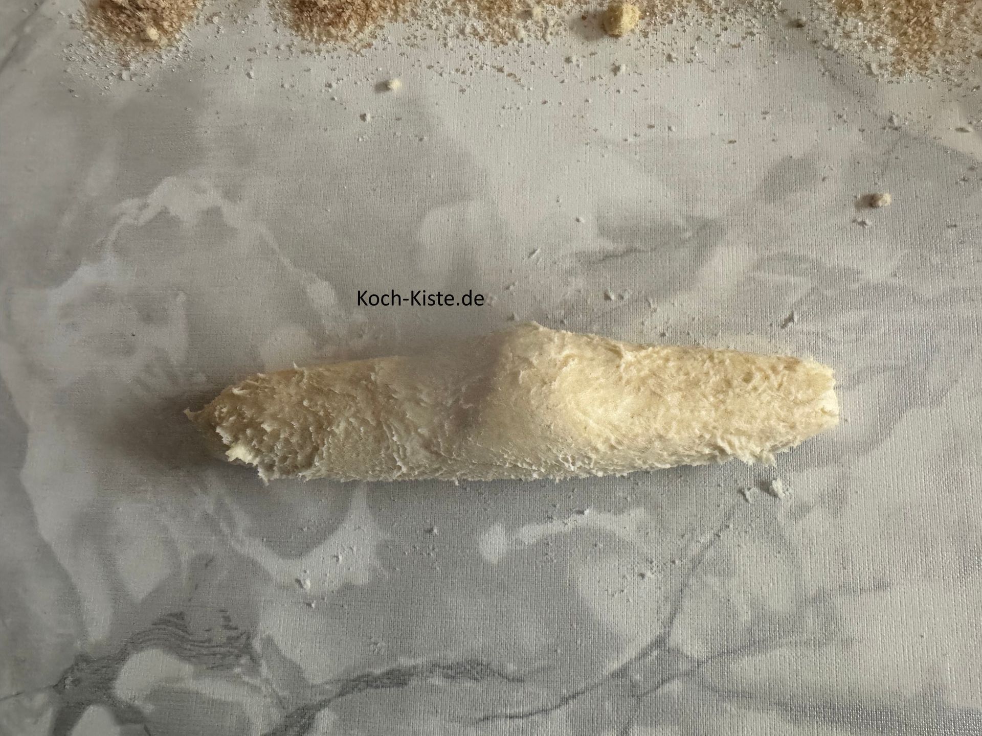 danach forme das Teigstück zu einer Art Rolle