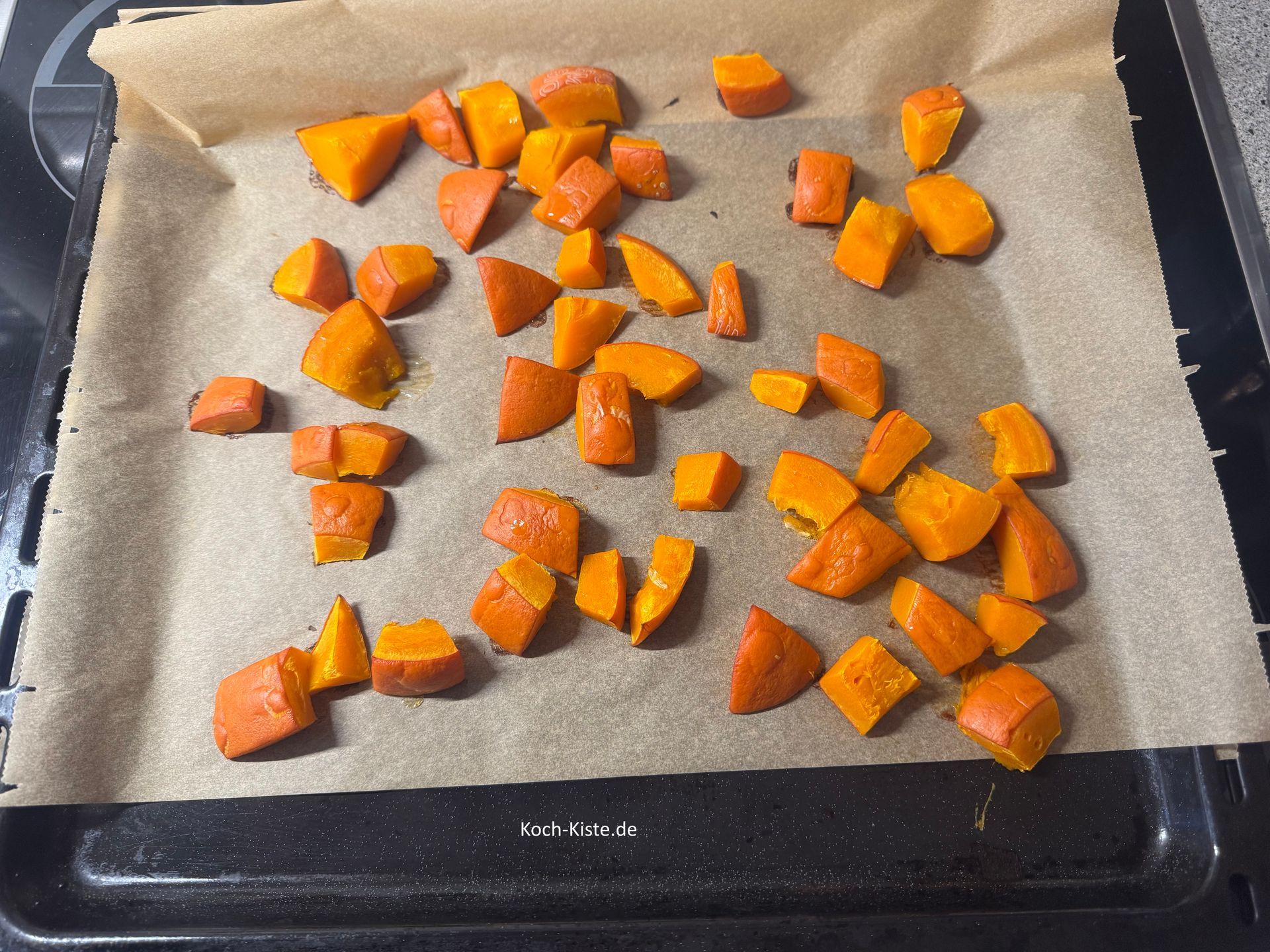 nehme das Backblech aus dem Backofen und stelle es auf den Herd