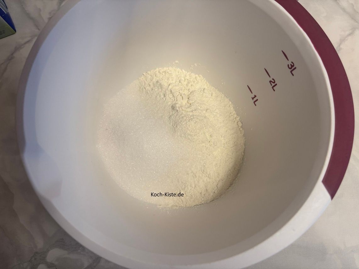 stelle die Küchenwaage wieder auf 0 und wiege 100 g Zucker ab