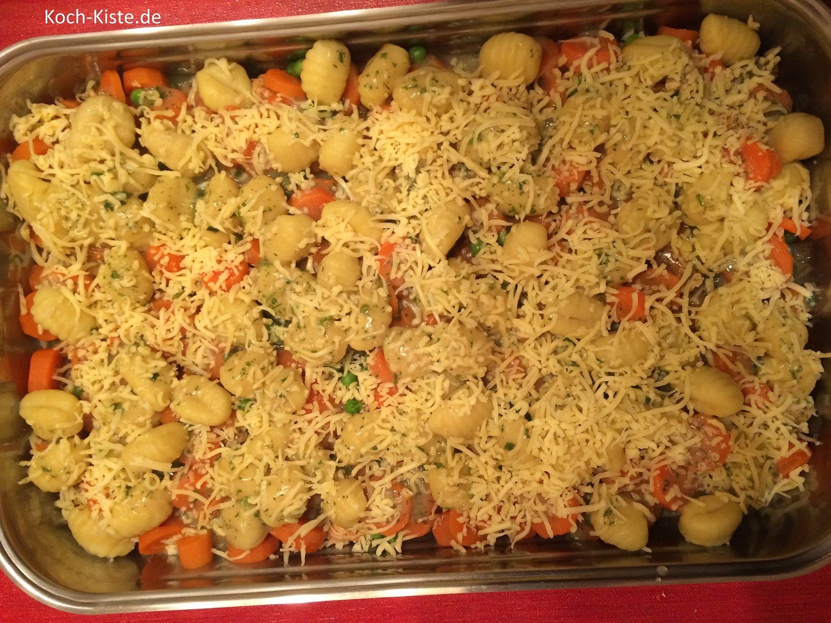 streue den Käse über den Auflauf