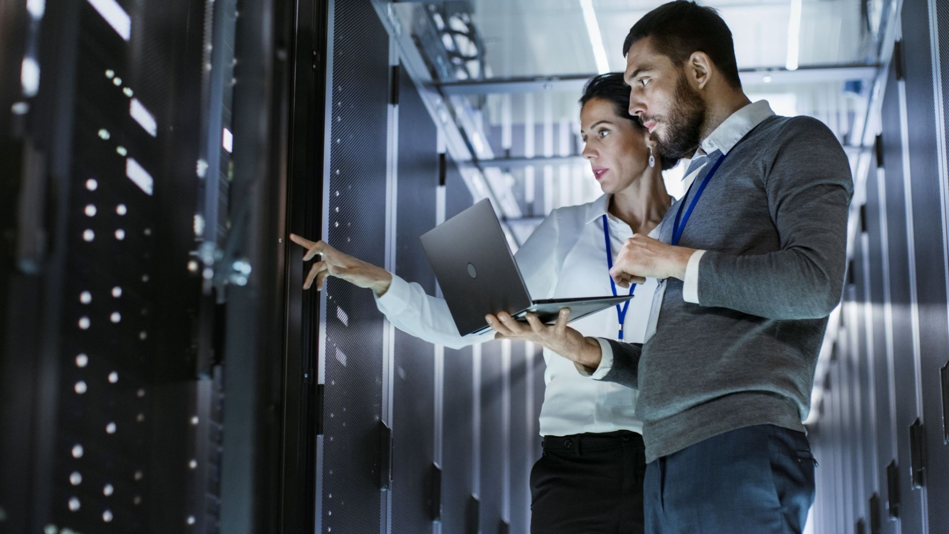 image of a man and woman operating computer services