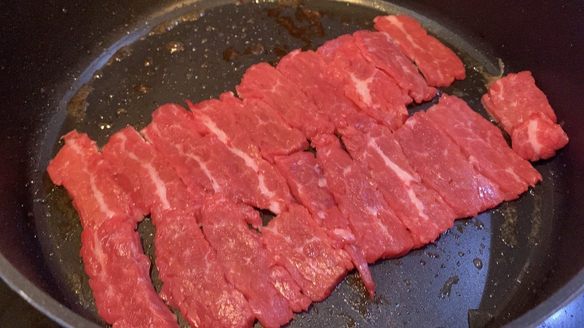 Frying beef and onions