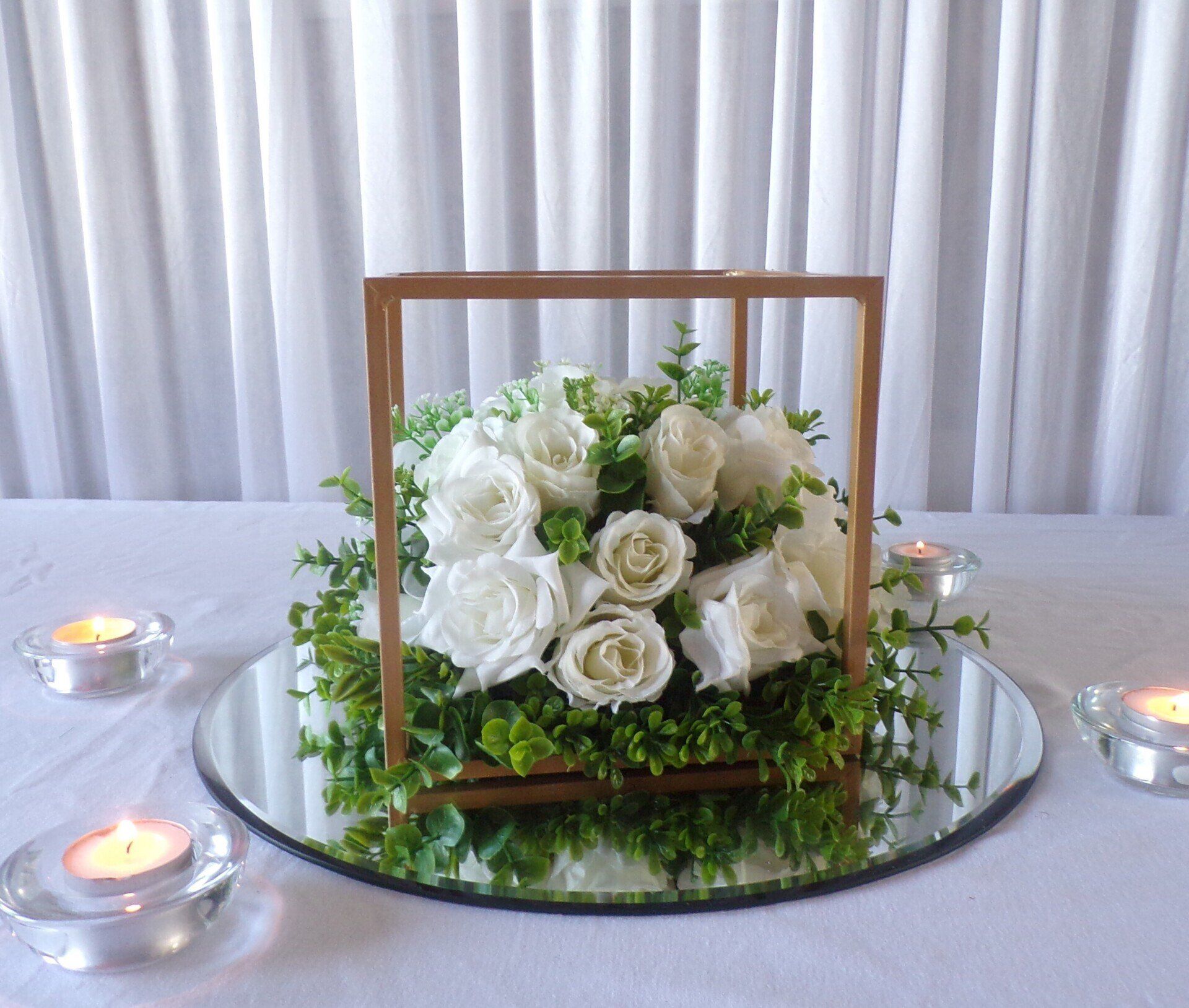 Small cube framed centrepiece with flowers