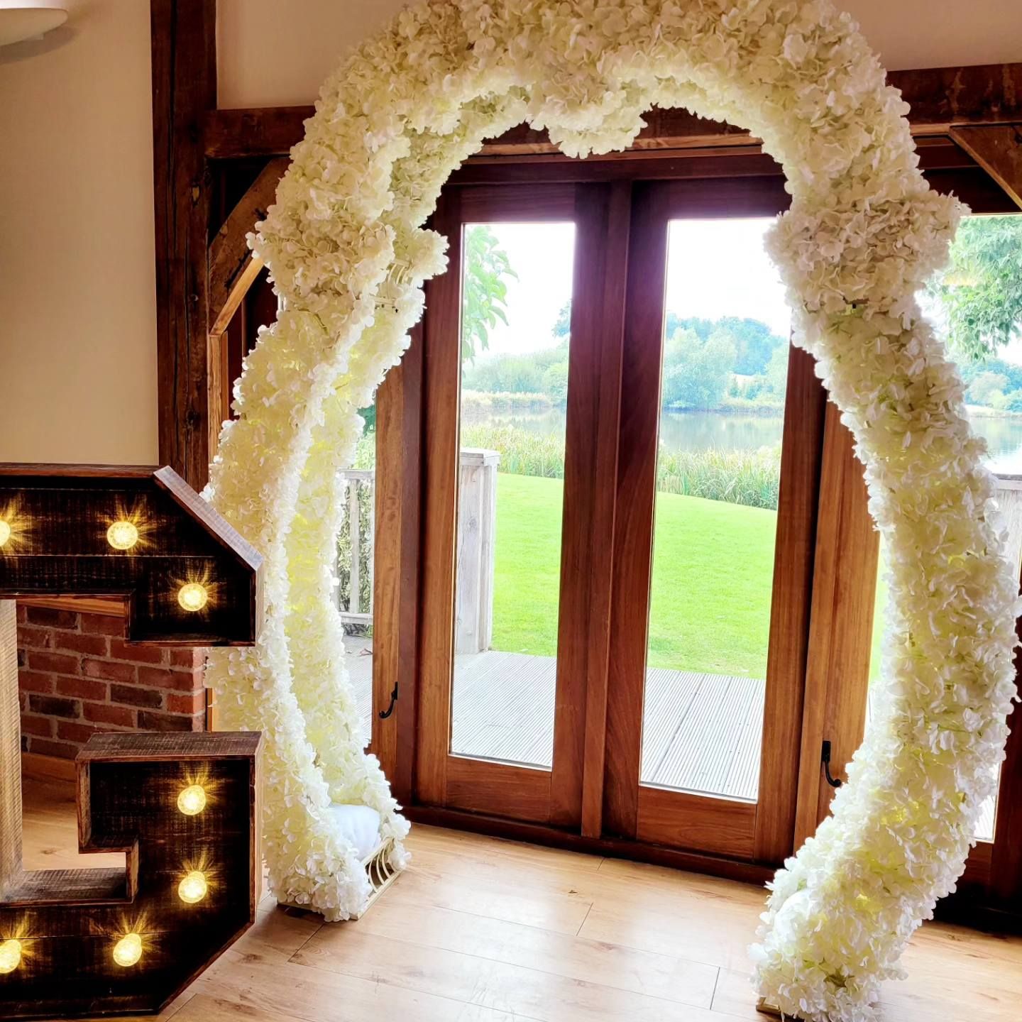 White blossom wedding arch