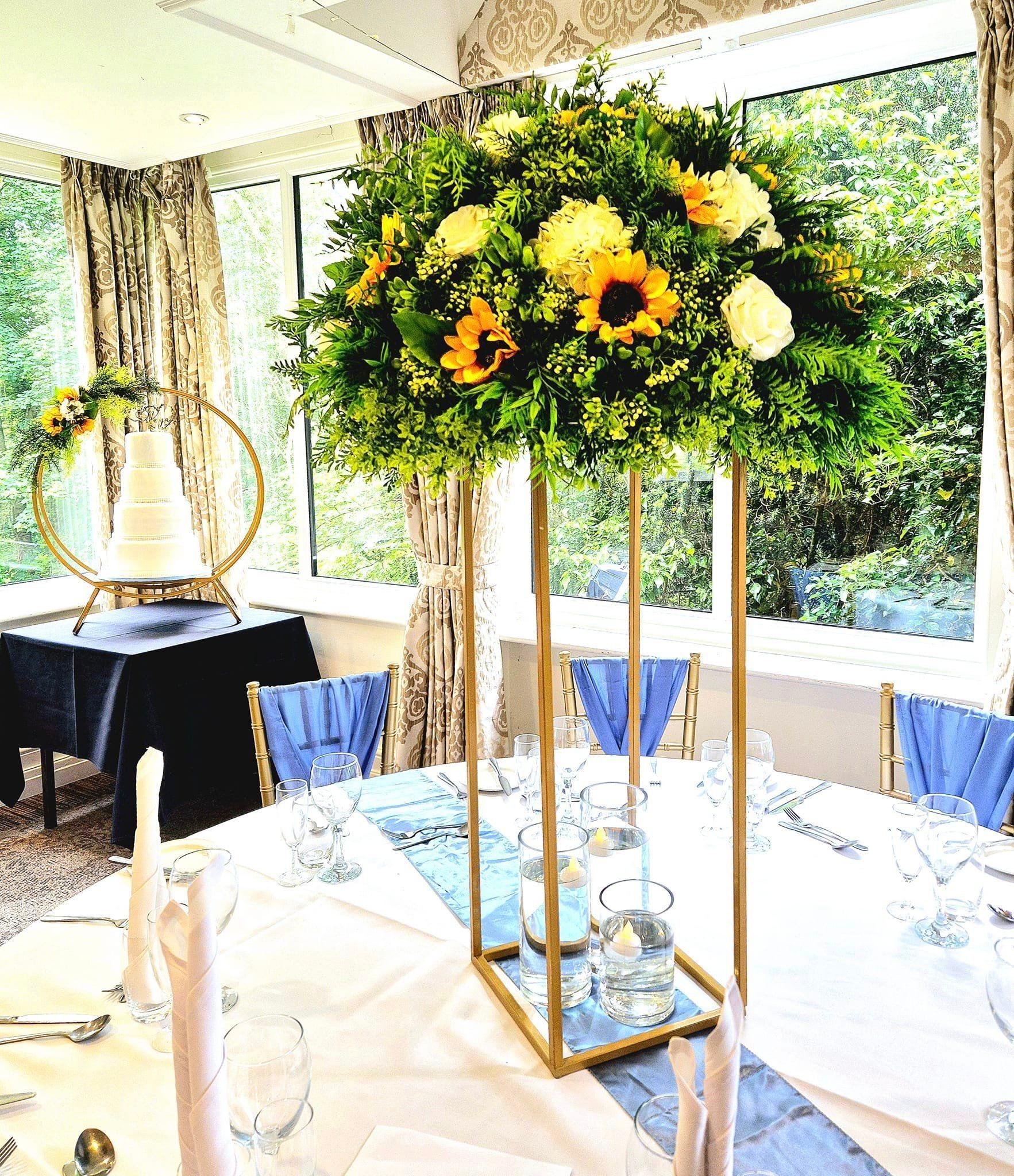 Rectangular framed centrepiece with foliage and flowers