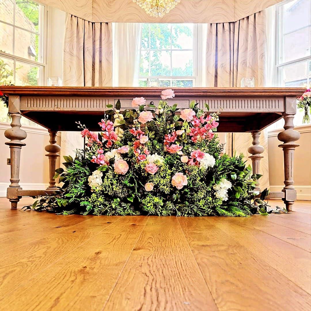 Silk floor arrangement of flowers for wedding ceremony in Cheshire.