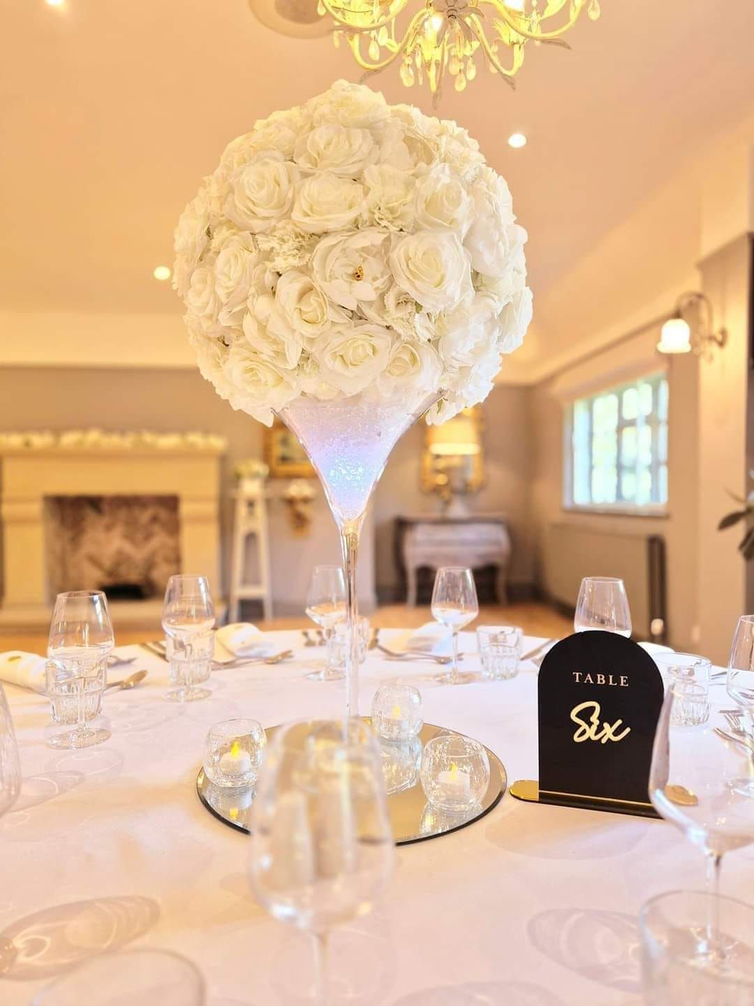 Glass martini vase centrepiece with arrangement
