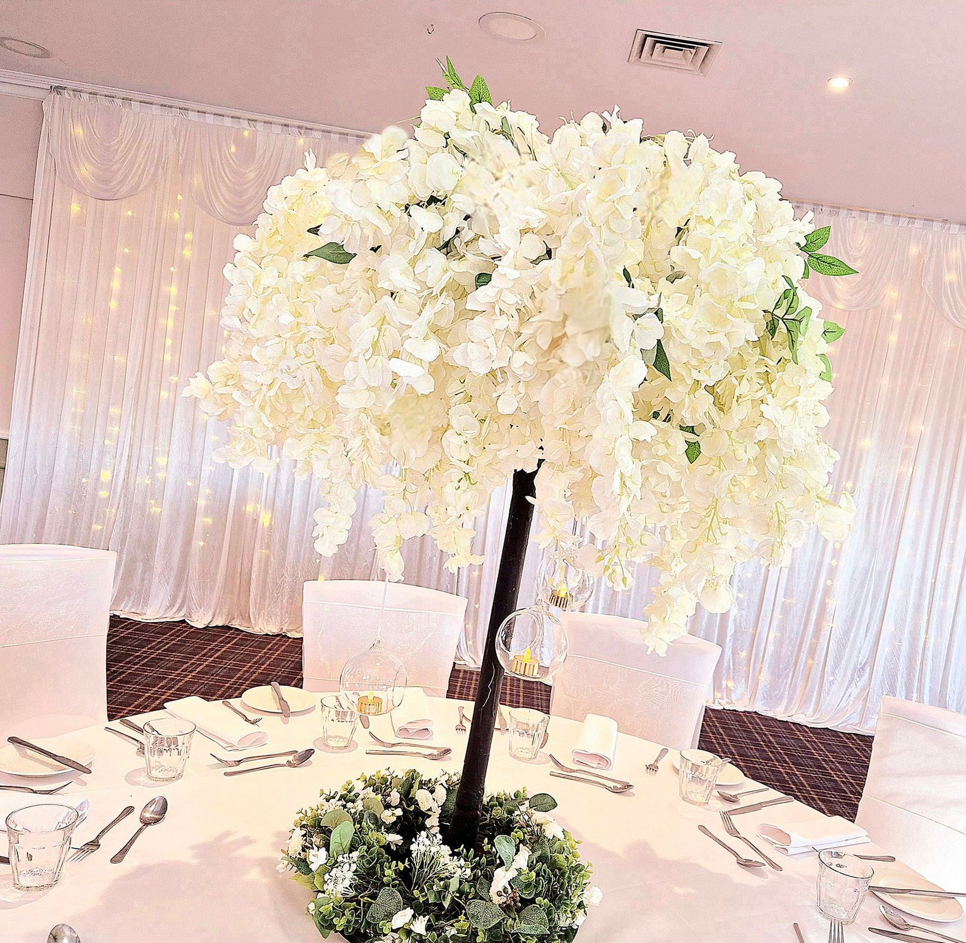 Wisteria tree centrepiece for wedding reception.