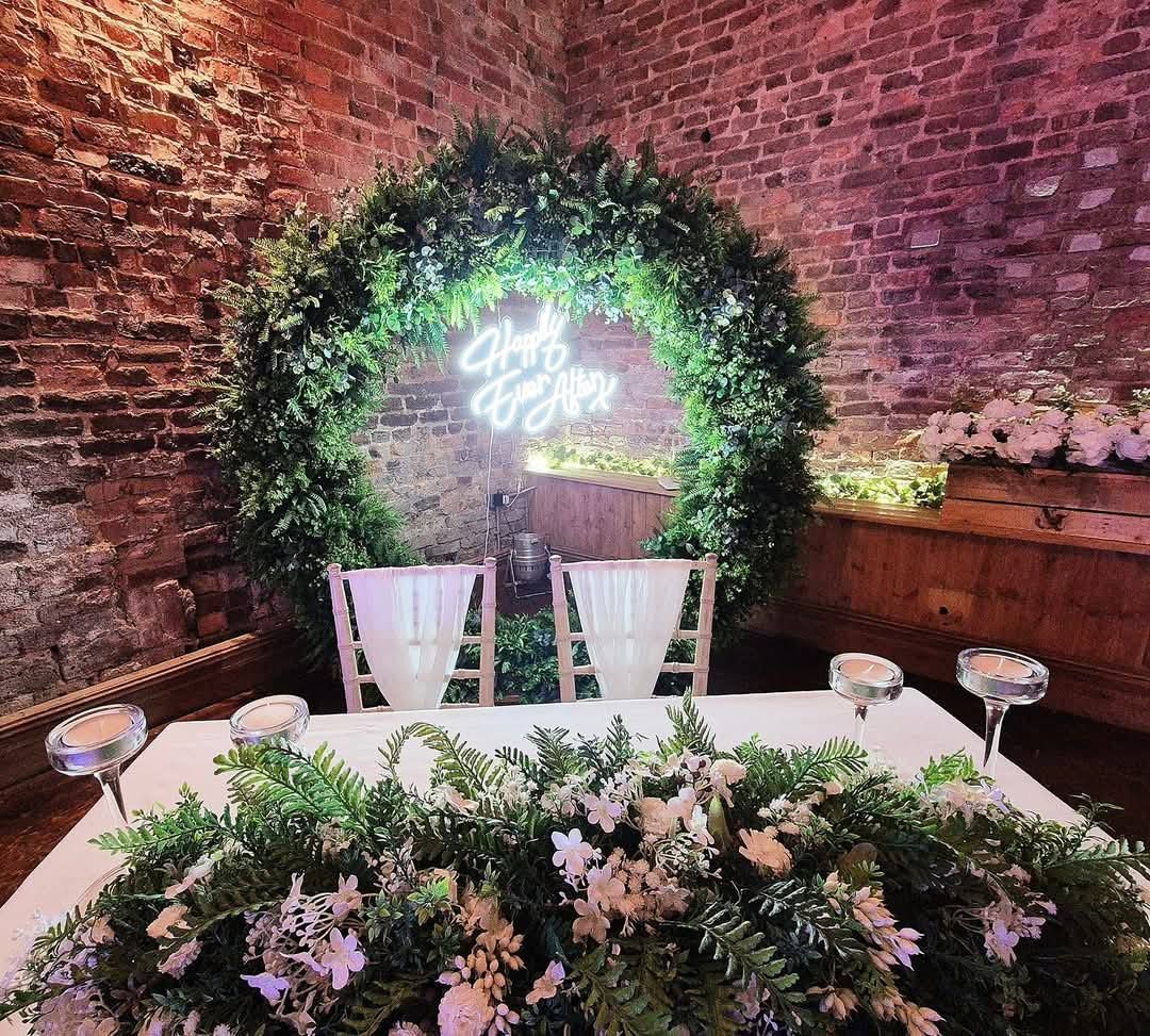 Beautiful spring vibes broken arch with matching hooped cake stand.