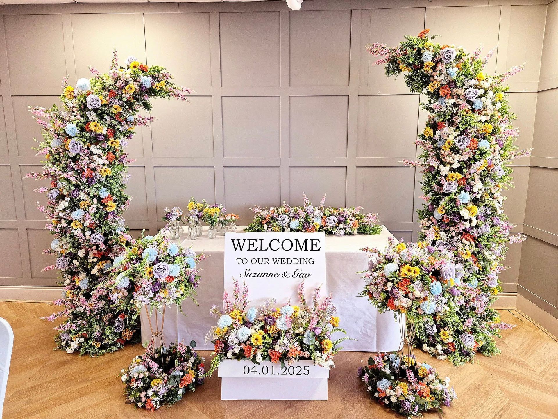 Spring 2025 wedding styling collection featuring blush and white silk flowers